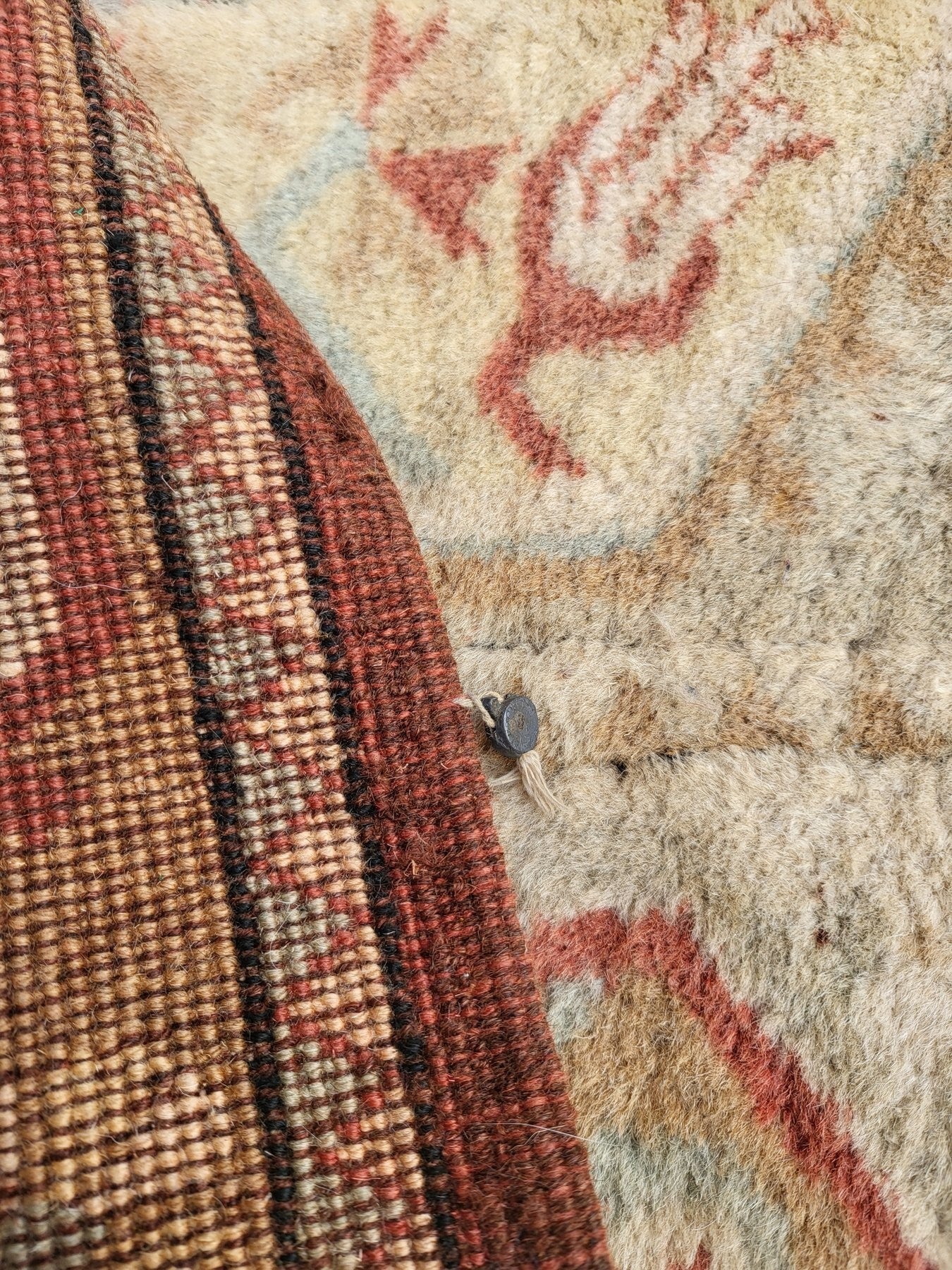 Handmade Turkish Milas wool rug measuring 120cm x 206cm. Central Salmon panel having three diamond shaped medallions