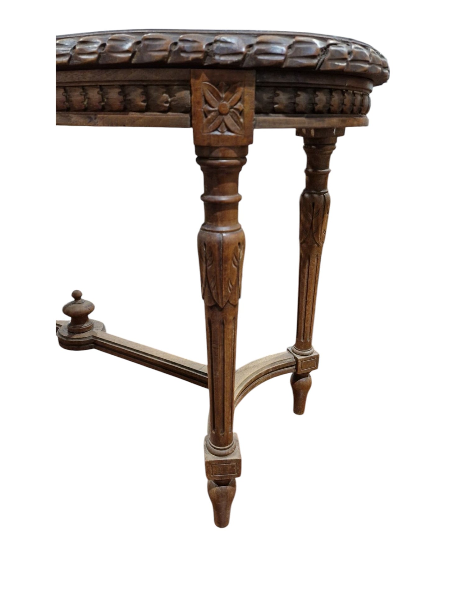 French walnut oval window seat in the Louis XVI-style with cane panel seat, carved frieze and raised