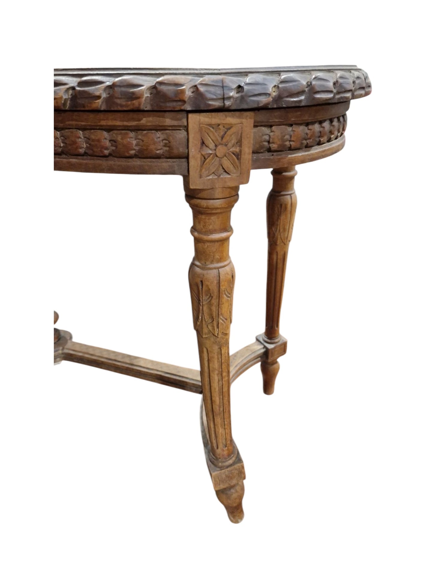French walnut oval window seat in the Louis XVI-style with cane panel seat, carved frieze and raised