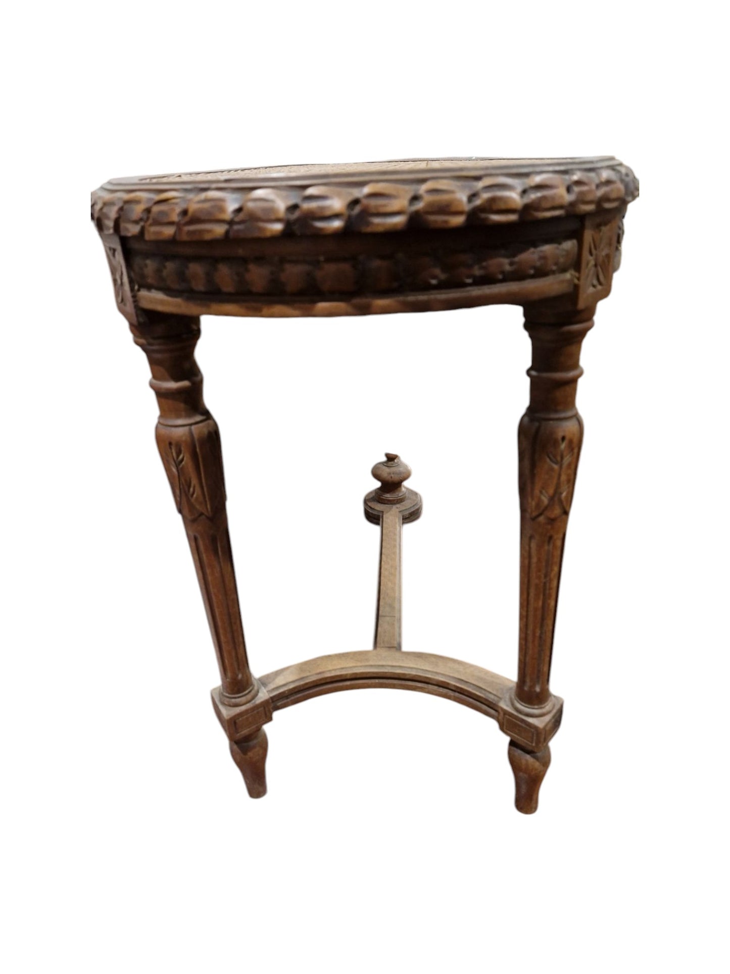 French walnut oval window seat in the Louis XVI-style with cane panel seat, carved frieze and raised