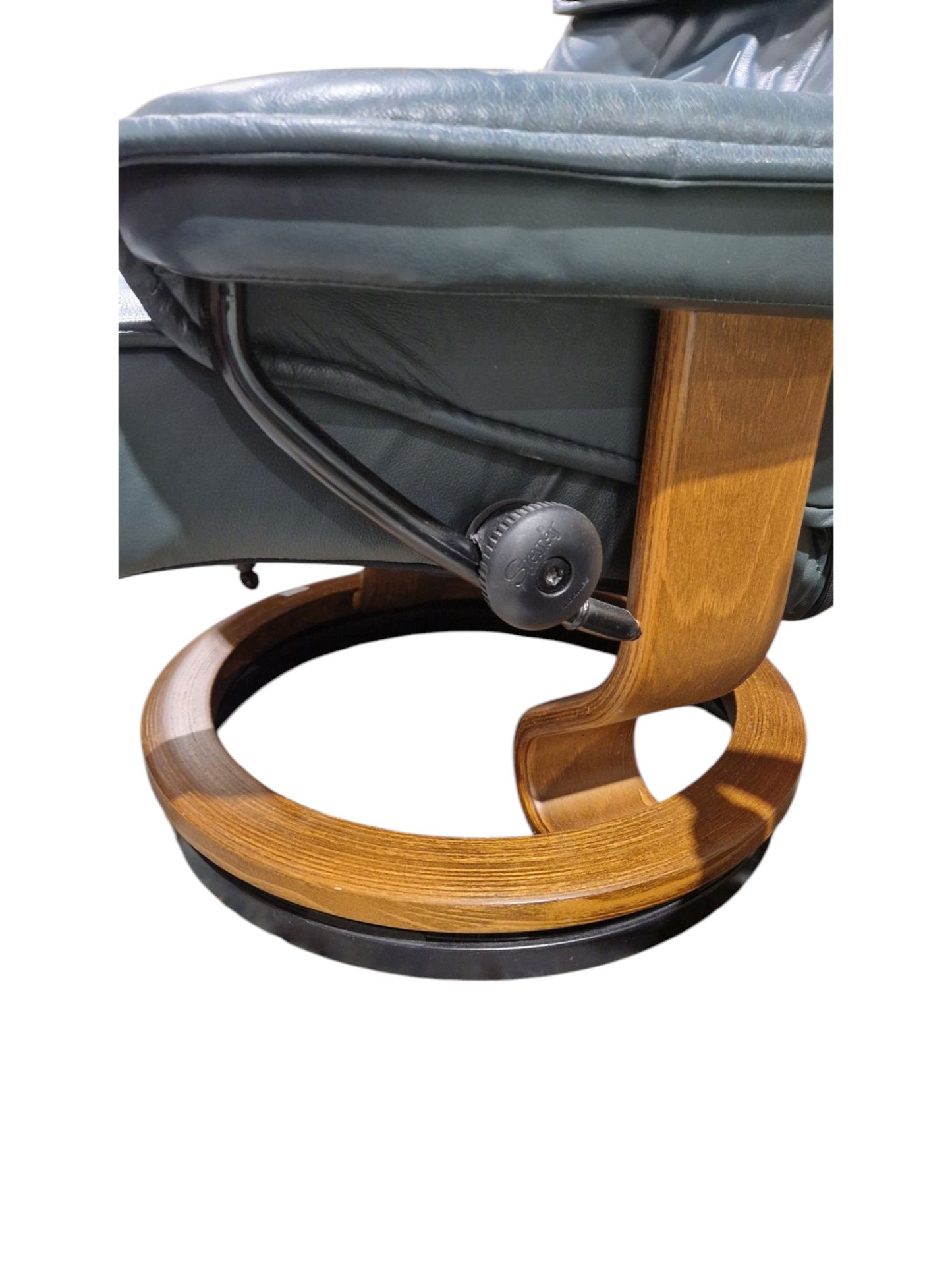 Norwegian Ekornes green leather Stressless lounge chair and matching footstool, both raised on
