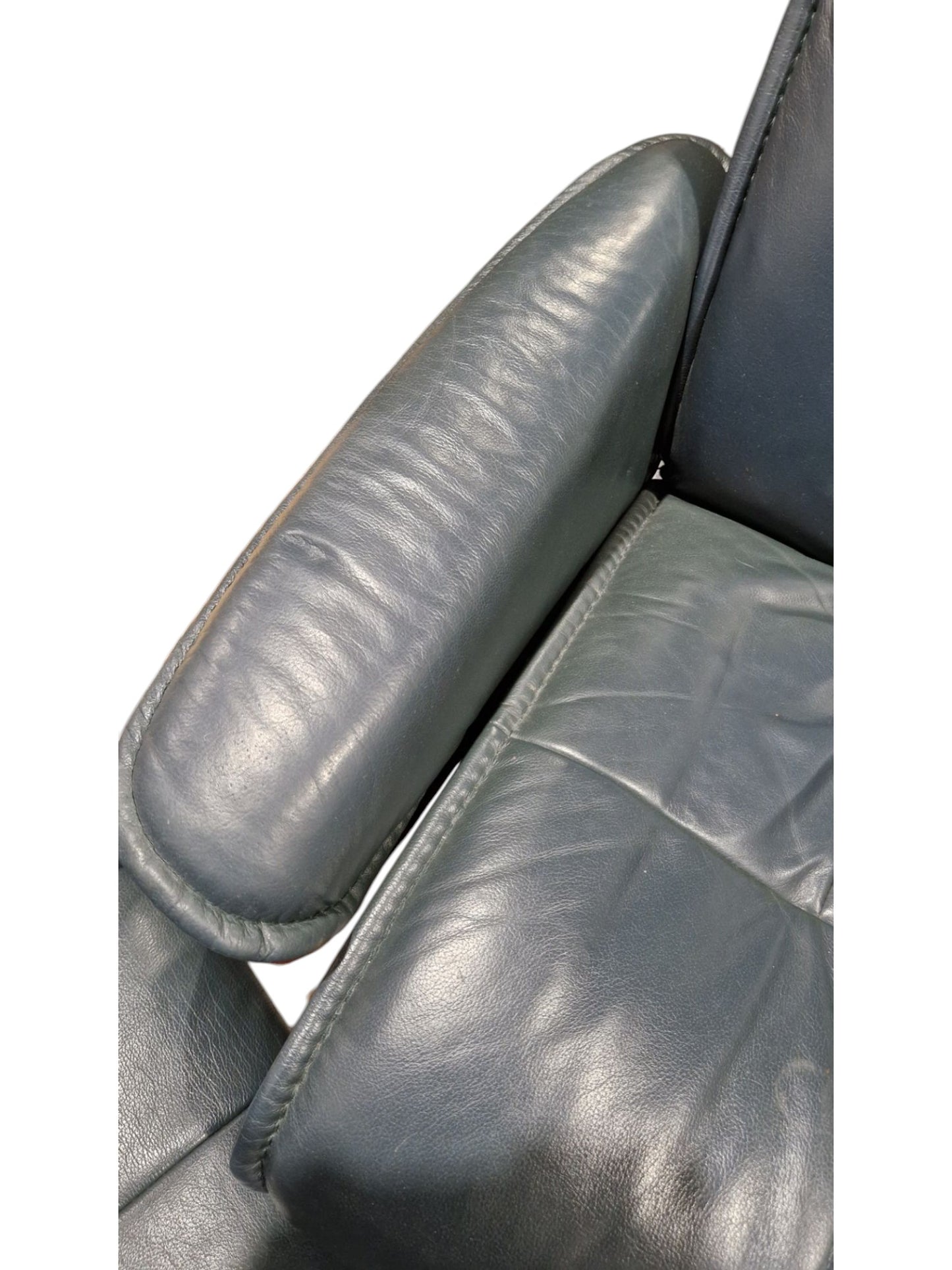 Norwegian Ekornes green leather Stressless lounge chair and matching footstool, both raised on