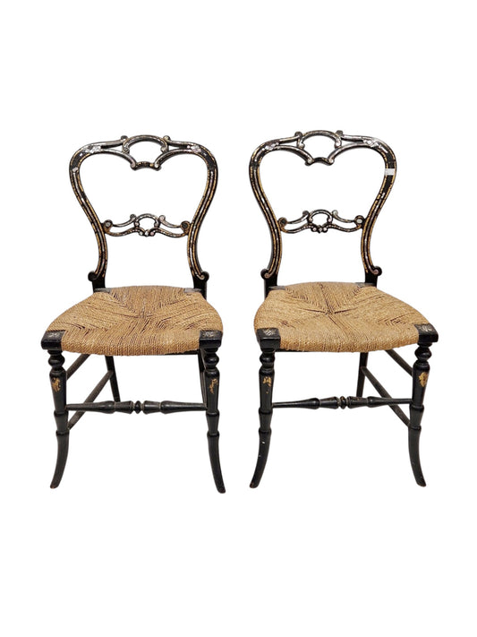 Pair of Victorian black lacquered bedroom chairs with gilt and mother-of-pearl decoration and rush