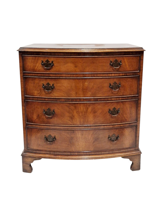 Mahogany bowfronted chest of four long graduating cockbeaded drawers, in the early 19th century